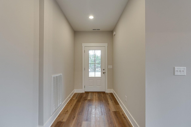 doorway with wood-type flooring