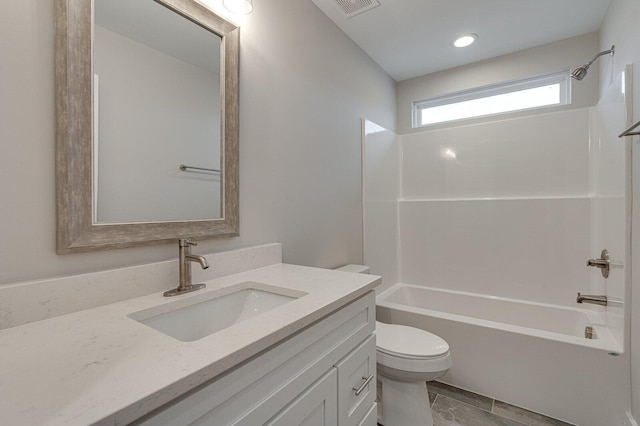 full bathroom with vanity, shower / bath combination, and toilet