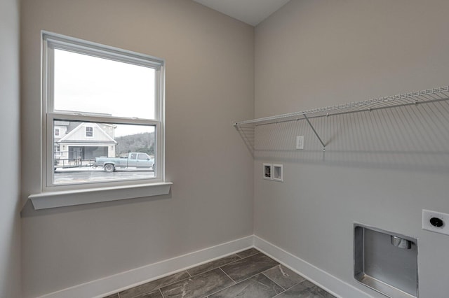 clothes washing area with hookup for a washing machine and hookup for an electric dryer