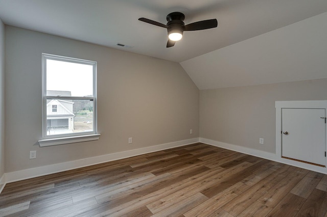 bonus room featuring ceiling fan, wood-type flooring, and vaulted ceiling