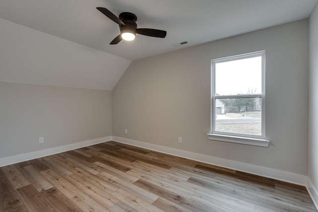 additional living space with light hardwood / wood-style floors, ceiling fan, and lofted ceiling