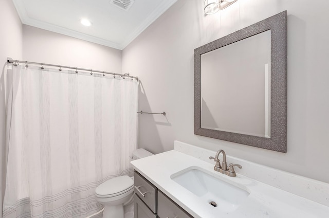 bathroom featuring crown molding, vanity, and toilet