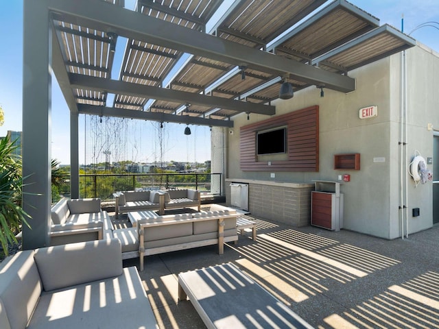 view of patio with an outdoor living space and a pergola