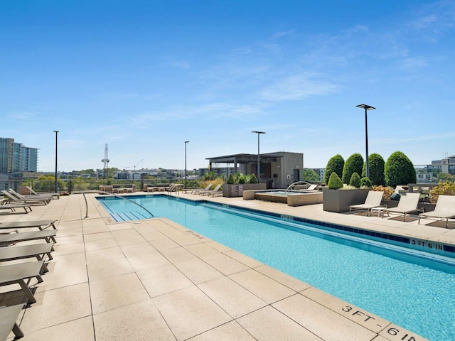 view of pool featuring a patio