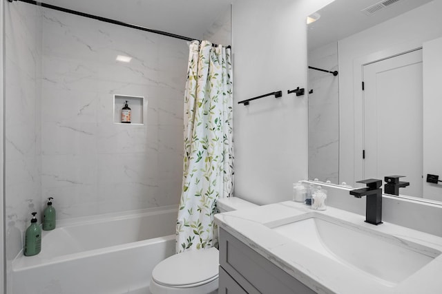 full bathroom with shower / tub combo with curtain, vanity, and toilet