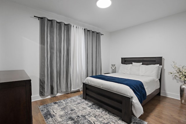 bedroom featuring dark hardwood / wood-style floors