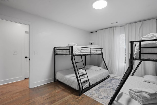 bedroom featuring dark hardwood / wood-style flooring