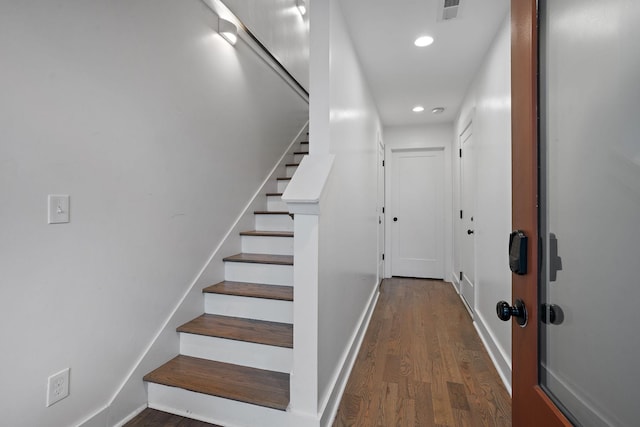 stairway featuring hardwood / wood-style flooring