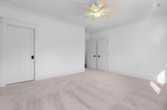 carpeted spare room with crown molding