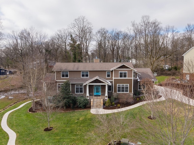 craftsman-style home with a front lawn