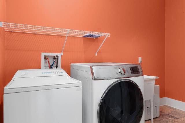 laundry area featuring independent washer and dryer