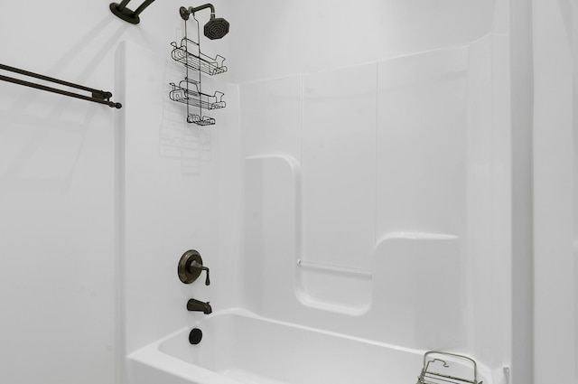 bathroom with shower / washtub combination