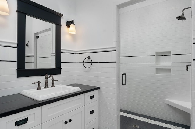 bathroom with vanity and a shower with shower door