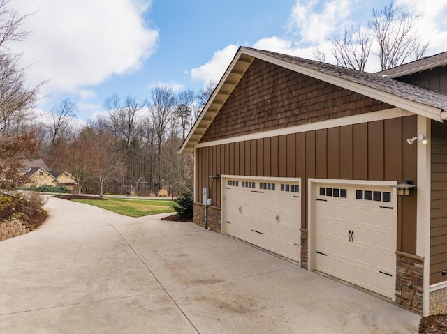 view of side of home featuring a garage