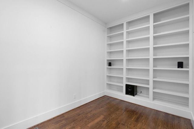 unfurnished room featuring dark hardwood / wood-style flooring