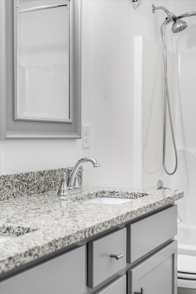 full bathroom featuring vanity, toilet, and bathtub / shower combination