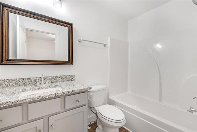 full bathroom featuring shower / tub combination, vanity, and toilet