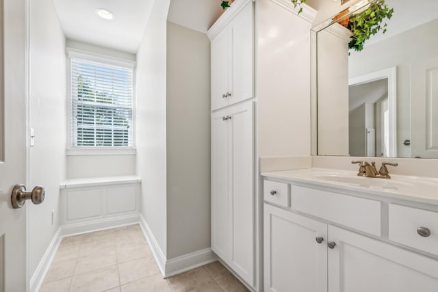 bathroom featuring tile patterned floors and vanity