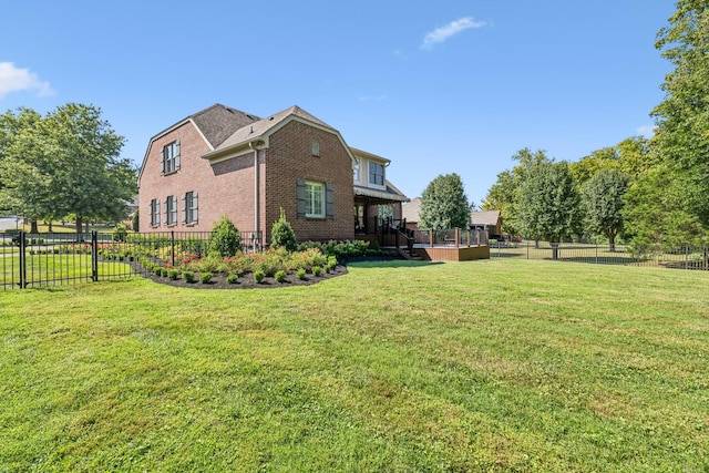 view of side of home with a lawn