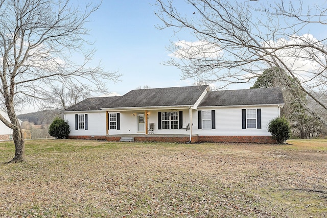 single story home featuring a front yard and covered porch