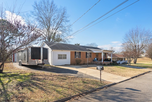 ranch-style house with a front yard