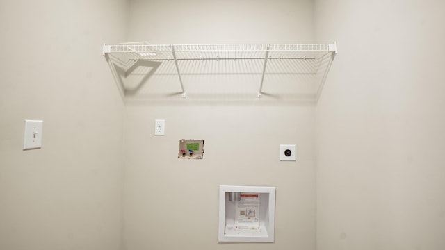 clothes washing area with hookup for a washing machine and hookup for an electric dryer