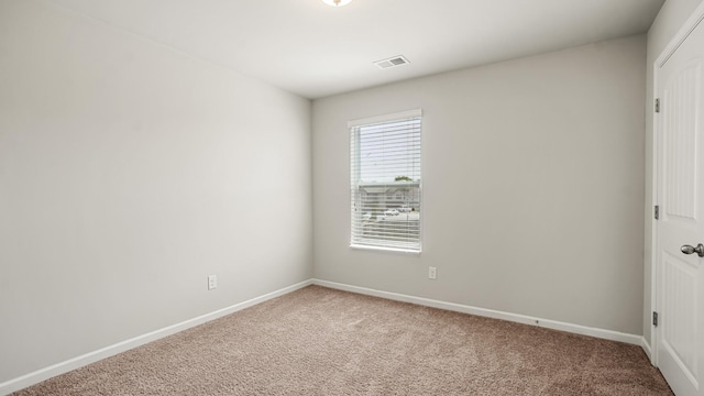 unfurnished room with carpet flooring