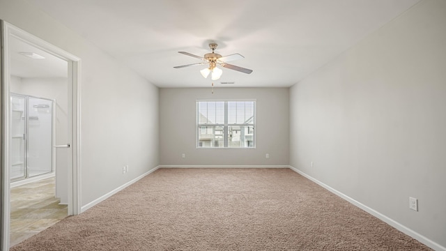 carpeted empty room with ceiling fan