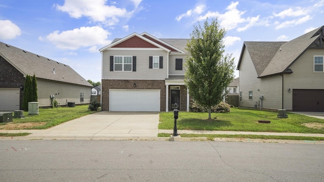 view of front of property with a front lawn, a garage, and central AC unit