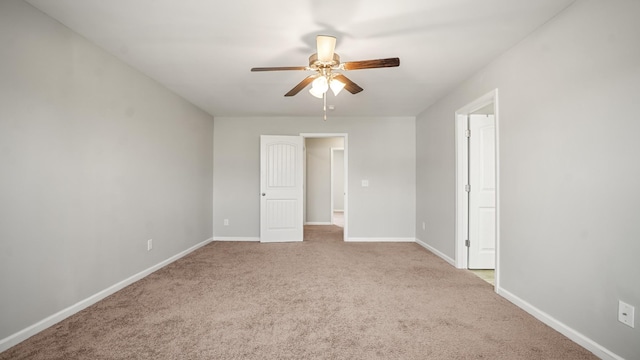 carpeted empty room with ceiling fan