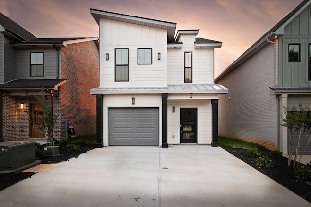 view of front of house featuring central air condition unit and a garage