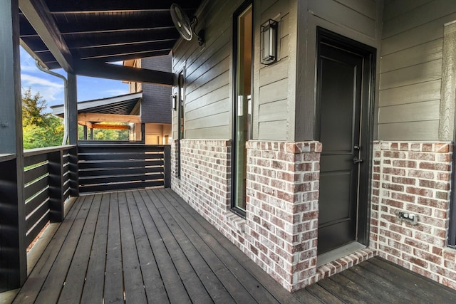 wooden deck featuring covered porch