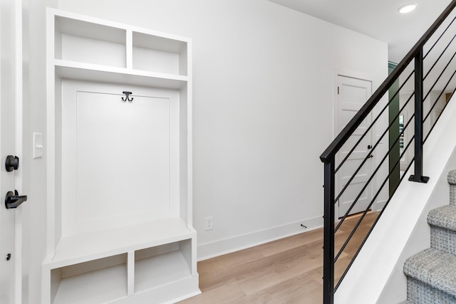 mudroom with light hardwood / wood-style floors