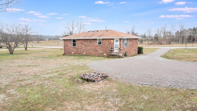 view of side of home featuring a yard