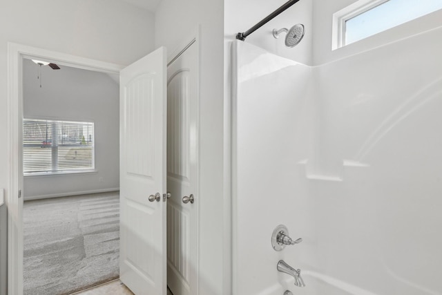 bathroom with shower / washtub combination