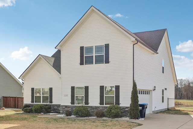 rear view of house with a garage