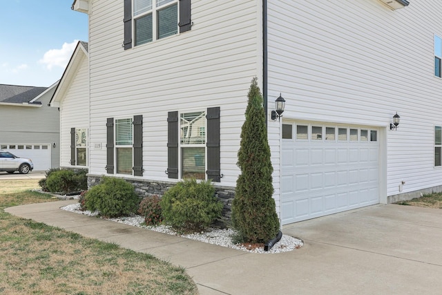 view of side of property with a garage