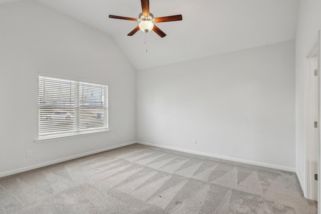 unfurnished room with light carpet, ceiling fan, and vaulted ceiling