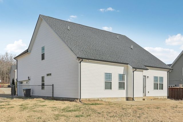 back of house featuring a yard