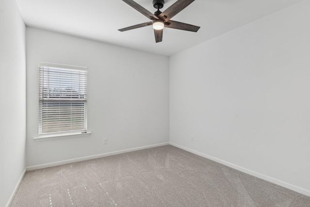 unfurnished room with carpet flooring and ceiling fan