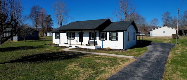 view of front of property with a porch and a front lawn