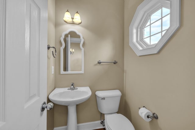 bathroom with toilet and sink