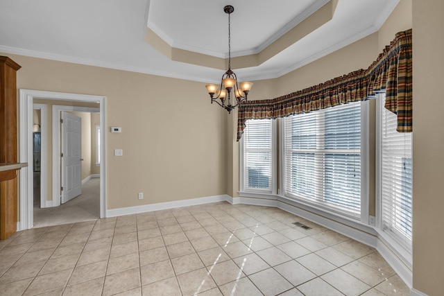 tiled empty room with a tray ceiling, a notable chandelier, and ornamental molding