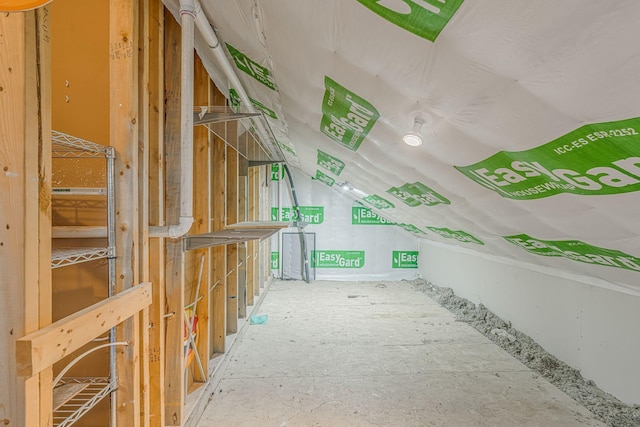 hallway featuring lofted ceiling