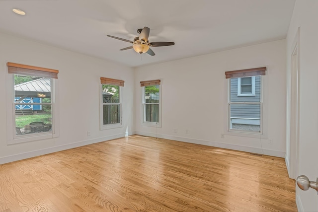 spare room featuring ceiling fan and light wood-type flooring