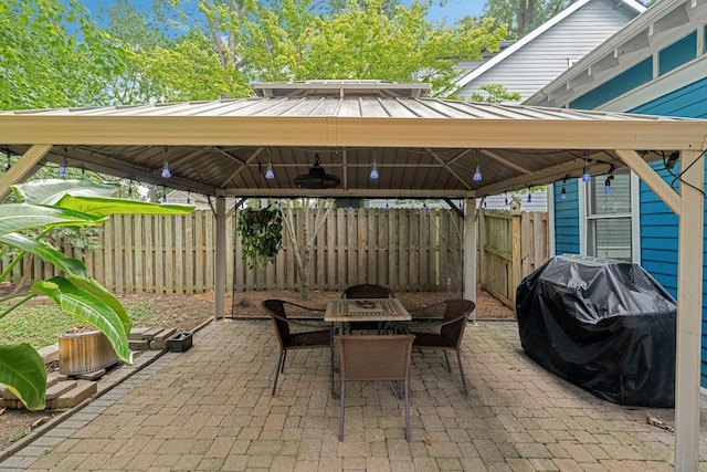 view of patio with a gazebo and a grill