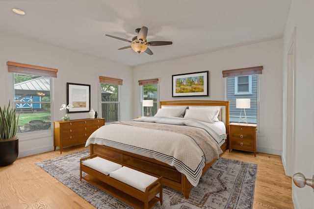 bedroom featuring light wood-type flooring and ceiling fan