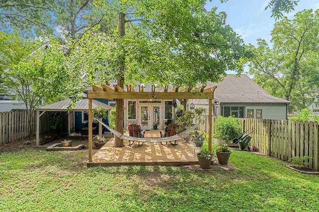 back of property featuring french doors, a pergola, and a yard