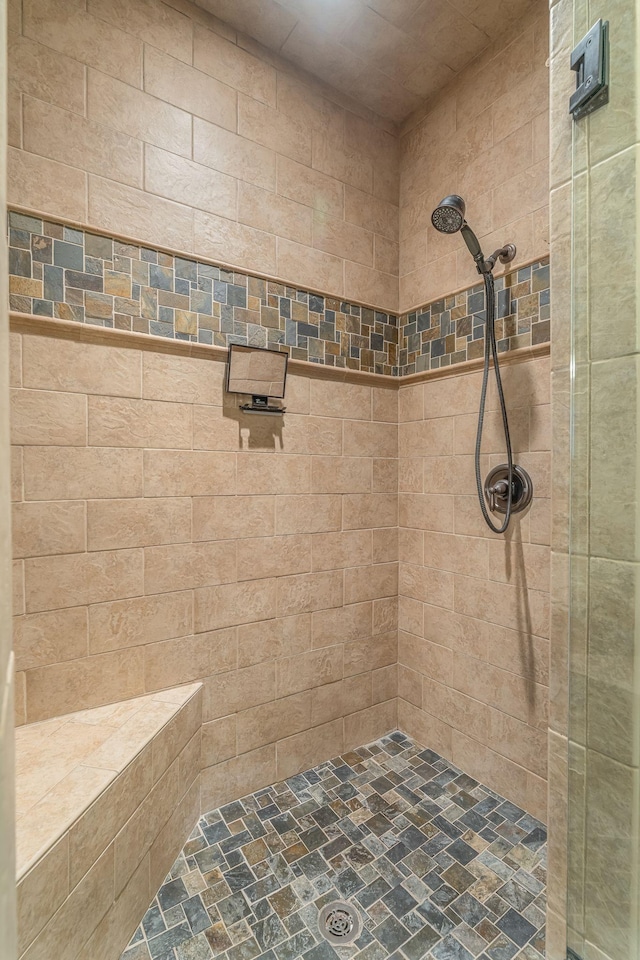 bathroom with tiled shower