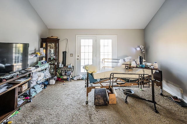 carpeted office space featuring vaulted ceiling